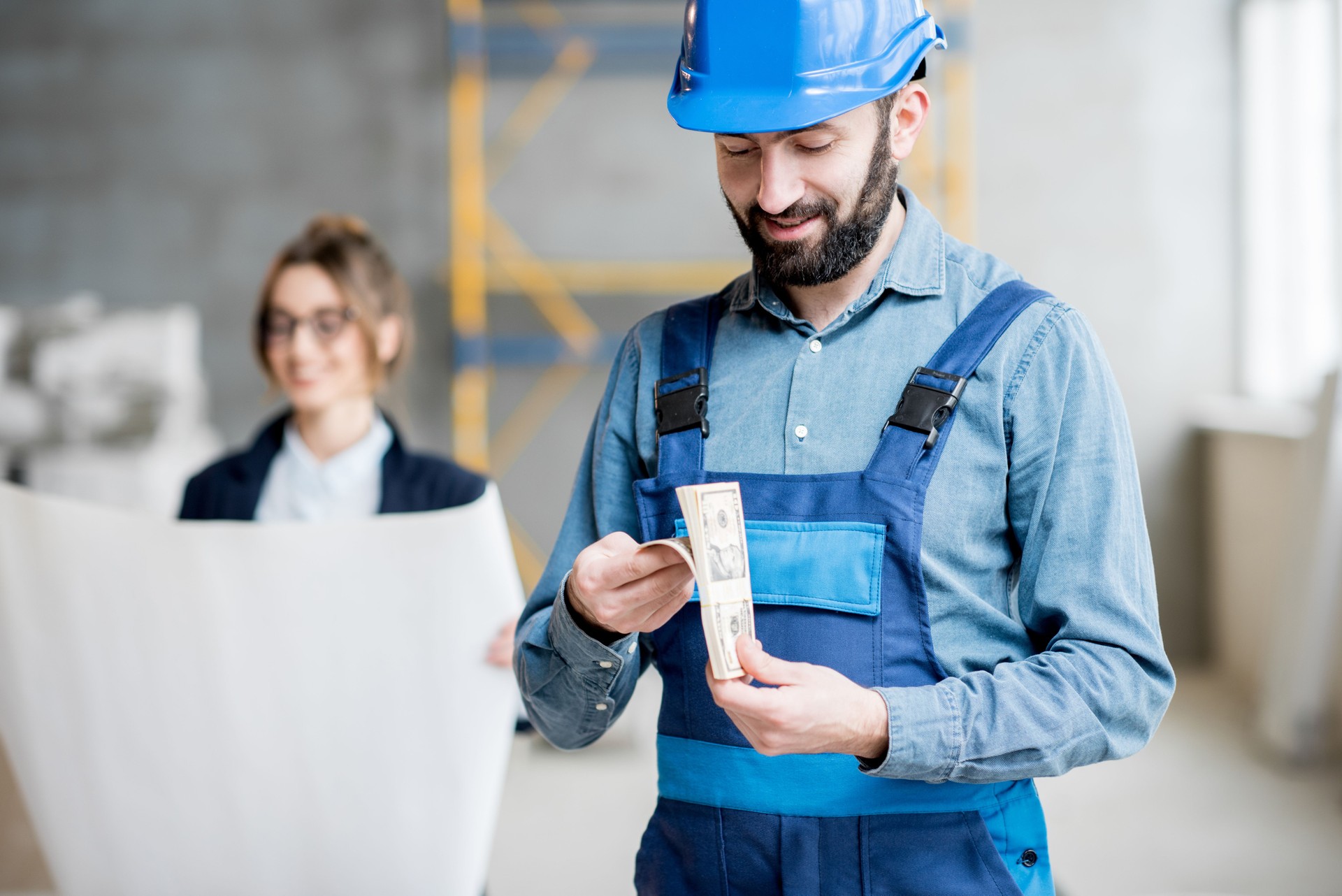Builder counting money